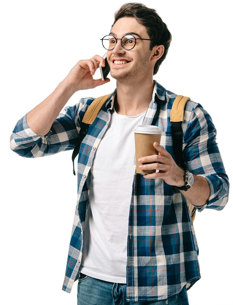 smiling handsome student talking by smartphone isolated on white